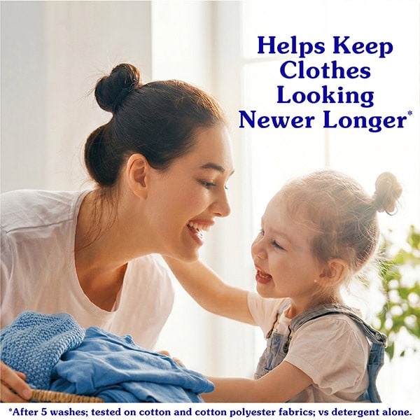 A mother and daughter laughing while holding a basket of clean blue laundry. Text reads: Helps Keep Clothes Looking Newer Longer after 5 washes.