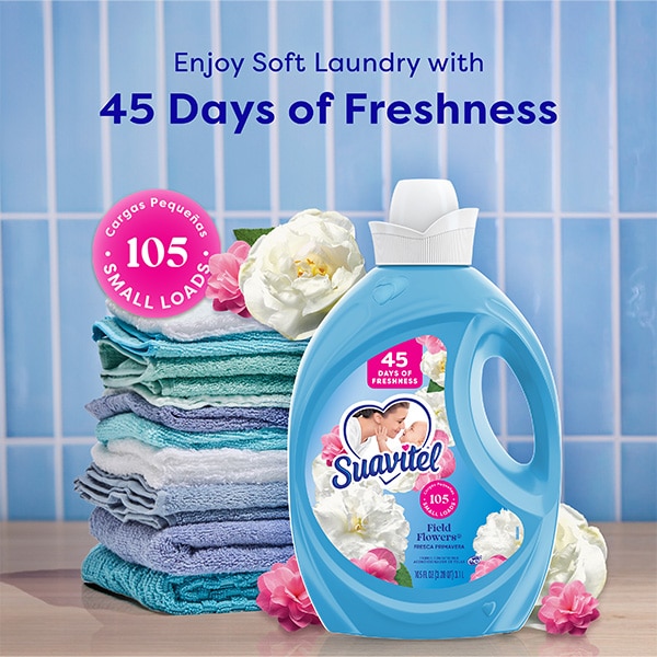 Suavitel Field Flowers Fabric Conditioner bottle displayed with folded towels and white flowers, highlighting '45 days of freshness' and '105 small loads' benefits against a blue tiled background